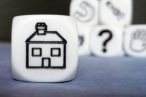 An image of a house on a cube.